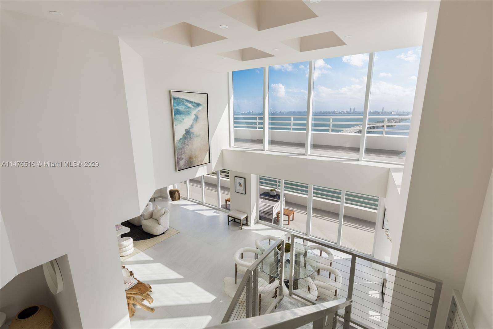 555 Northeast 34th Street, Unit PH5 Miami, FL 33137 - Photo 6 of 29 a view of a living room and dining room