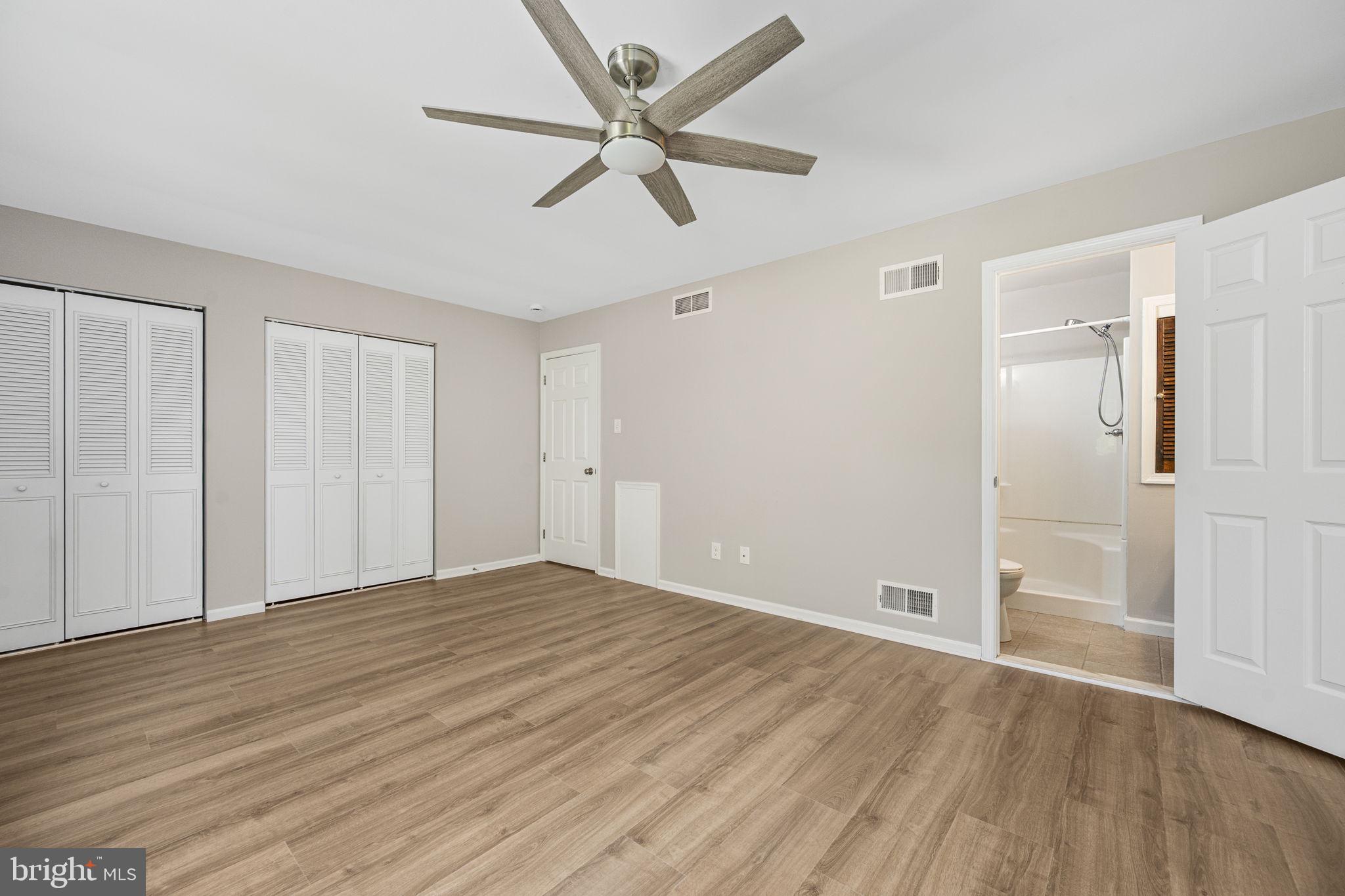 113 Talgrath Court Exton, PA 19341 - Photo 14 of 25 an empty room with wooden floor fan and windows