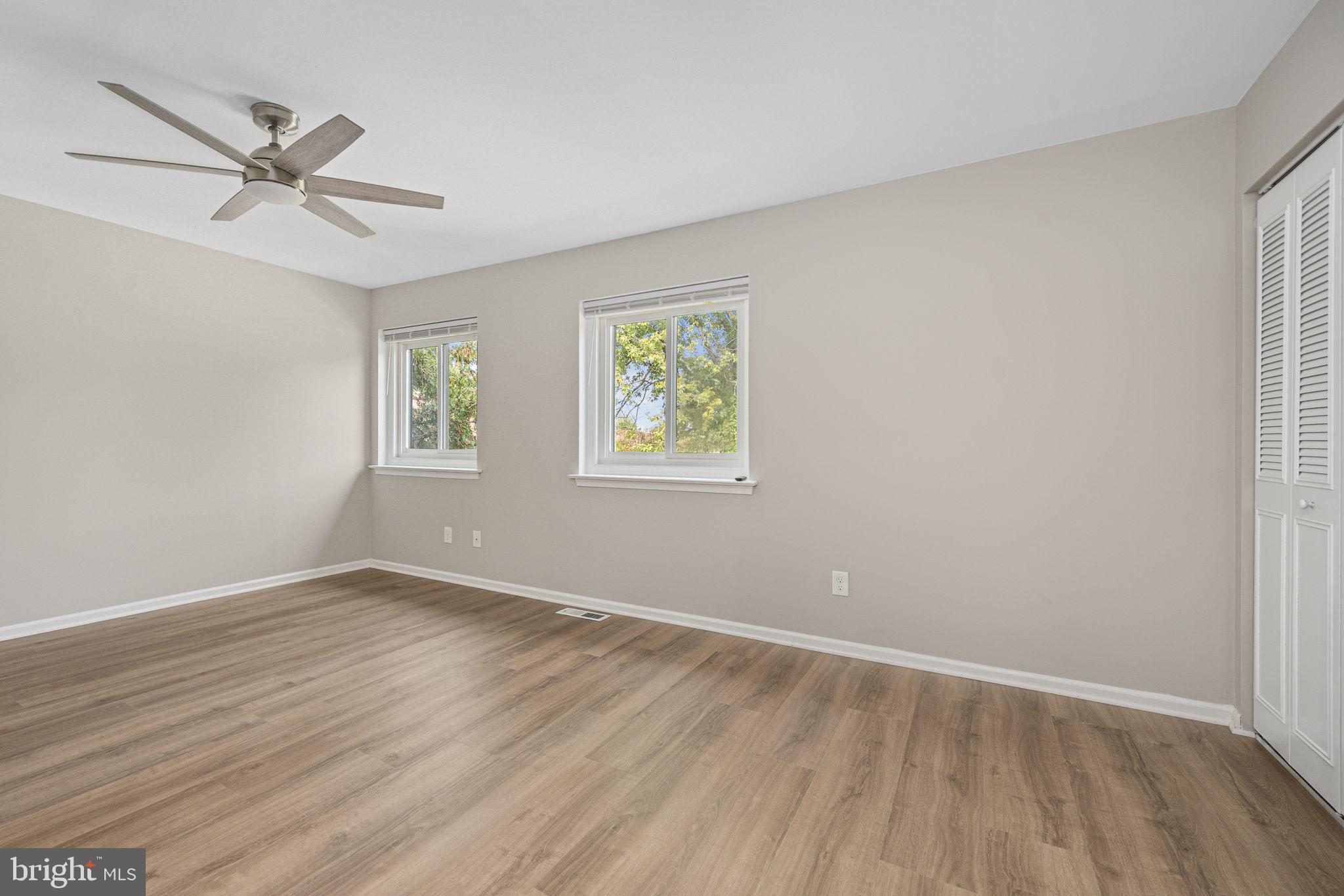 113 Talgrath Court Exton, PA 19341 - Photo 15 of 25 an empty room with wooden floor window and ceiling fan