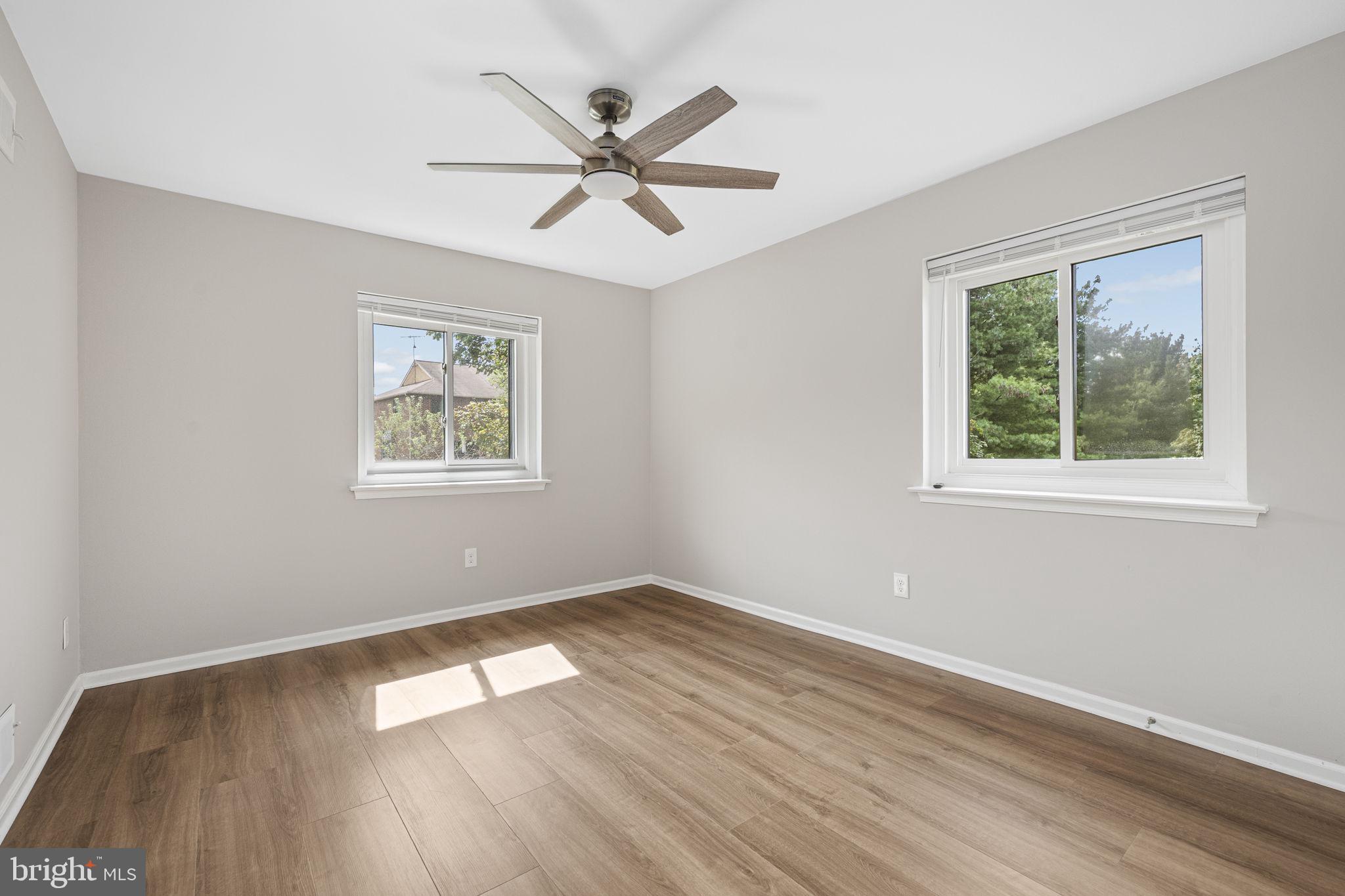 113 Talgrath Court Exton, PA 19341 - Photo 18 of 25 a view of empty room with wooden floor and fan