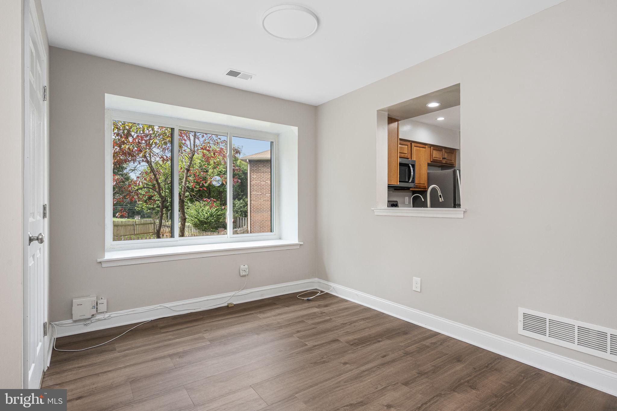 113 Talgrath Court Exton, PA 19341 - Photo 10 of 25 a view of an empty room with wooden floor and a window