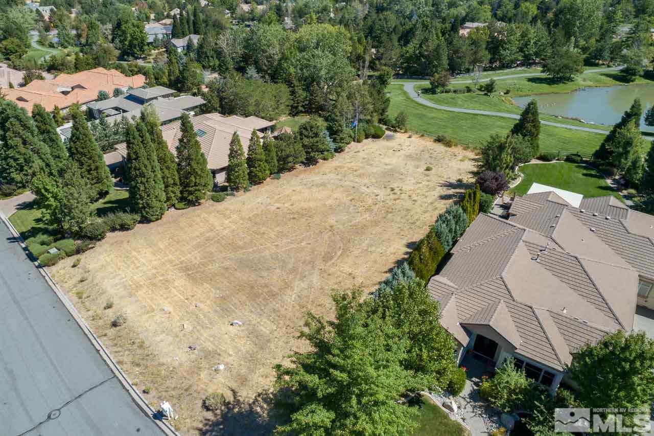 4535 Mountaingate Drive Reno, NV 89519 - Photo 4 of 5 an aerial view of a house with a yard and lake view