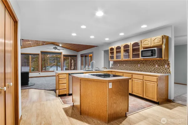 a kitchen with stainless steel appliances granite countertop a stove and cabinets
