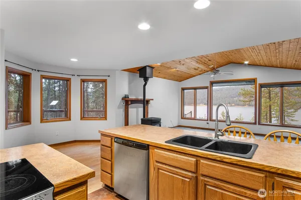 a kitchen that has a sink and a stove