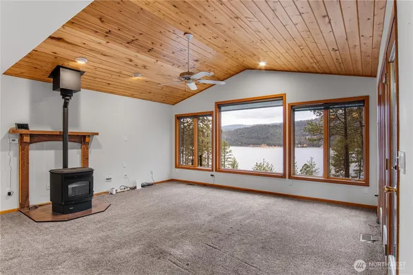 a view of an empty room with a fireplace