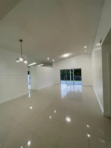 a view of a big room with windows