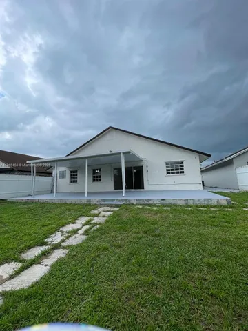 a view of an empty room with a bathroom