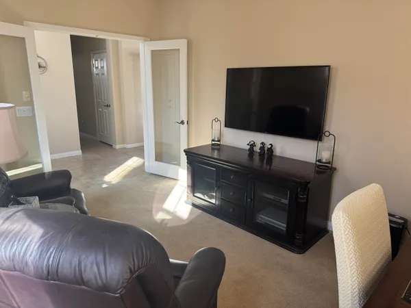 a bedroom with a bed and a couch