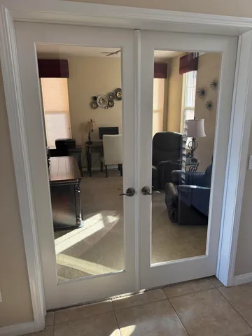 a backyard of a house with furniture and outdoor seating