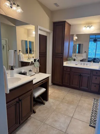 a large bed sitting in a bedroom next to a window