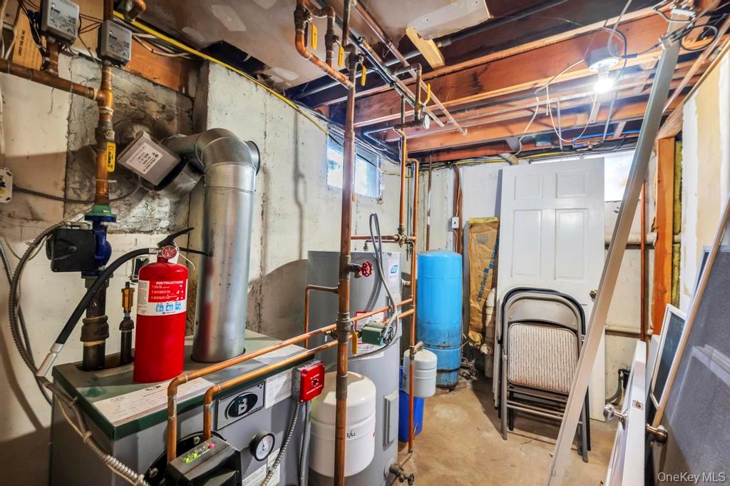 39 Bevin Road Northport, NY 11768 - Photo 39 of 44 Utilities featuring a heating unit and electric water heater