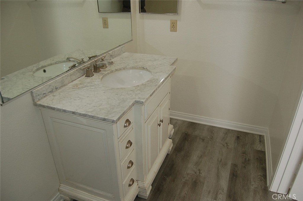 47 Deer Creek Road Phillips Ranch, CA 91766 - Photo 17 of 24 a bathroom with a granite countertop sink and a mirror