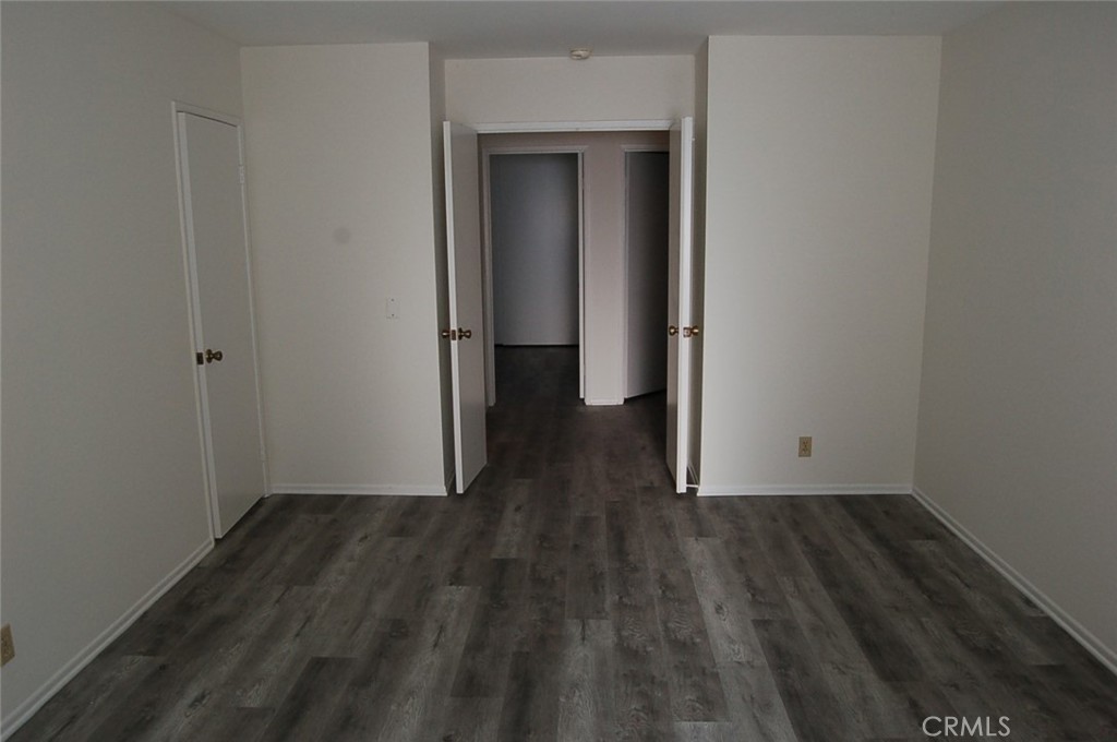 47 Deer Creek Road Phillips Ranch, CA 91766 - Photo 18 of 24 a view of an empty room with wooden floor and closet