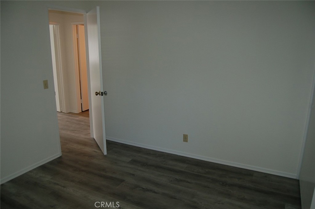 47 Deer Creek Road Phillips Ranch, CA 91766 - Photo 20 of 24 an empty room with wooden floor and closet