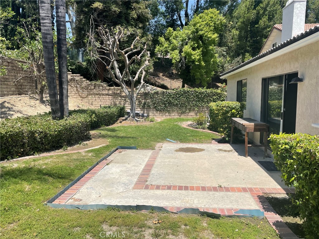 47 Deer Creek Road Phillips Ranch, CA 91766 - Photo 22 of 24 a view of a backyard with potted plants