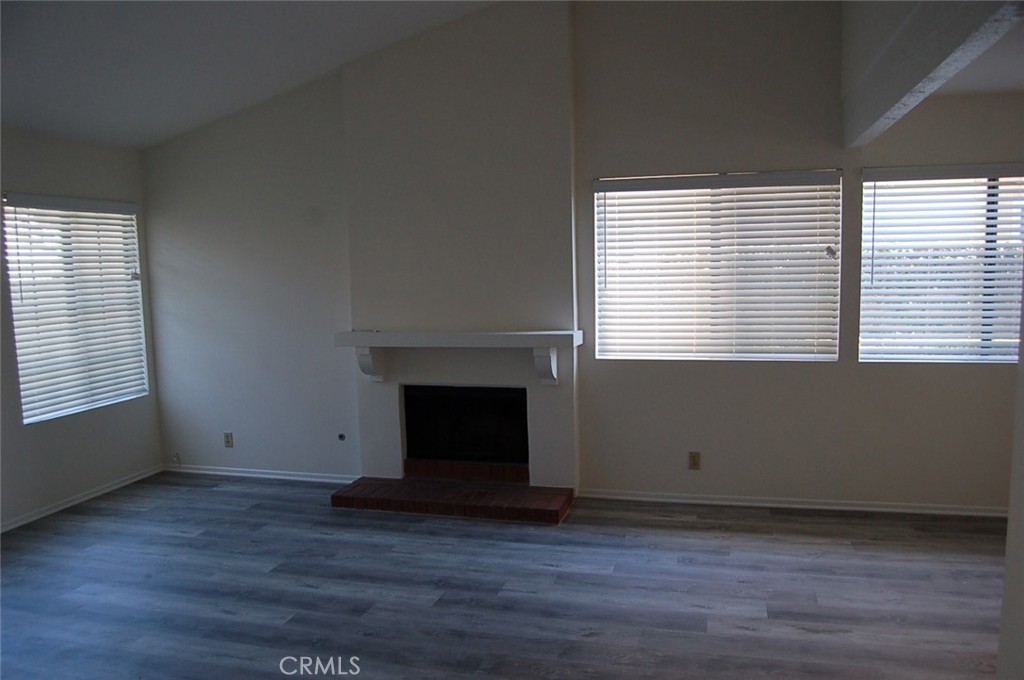 47 Deer Creek Road Phillips Ranch, CA 91766 - Photo 6 of 24 a view of an empty room with wooden floor and a window