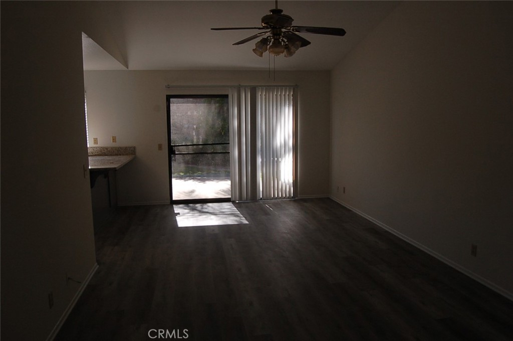 47 Deer Creek Road Phillips Ranch, CA 91766 - Photo 8 of 24 wooden floor in an empty room with a window