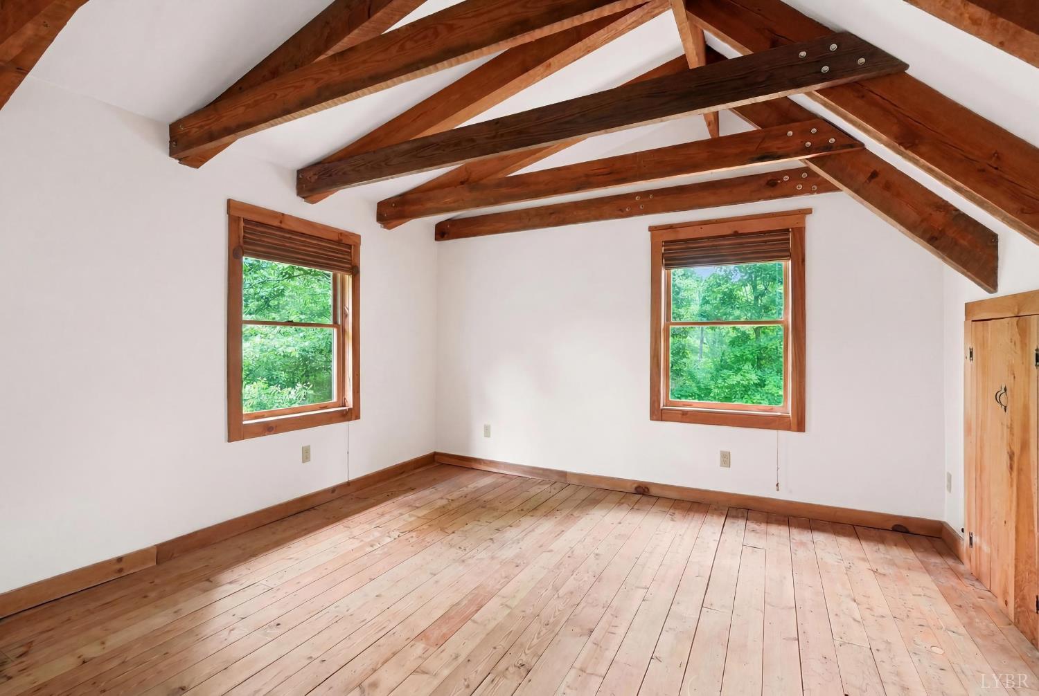 Undisclosed Address Spout Spring, VA 24593 - Photo 46 of 96 a view of an empty room with wooden floor and a window