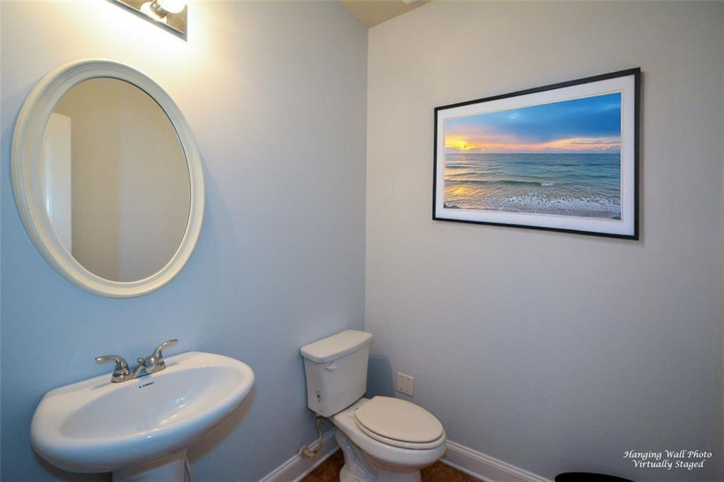 917 Revere Way Hampton, GA 30228 - Photo 11 of 25 a bathroom with a toilet and a sink