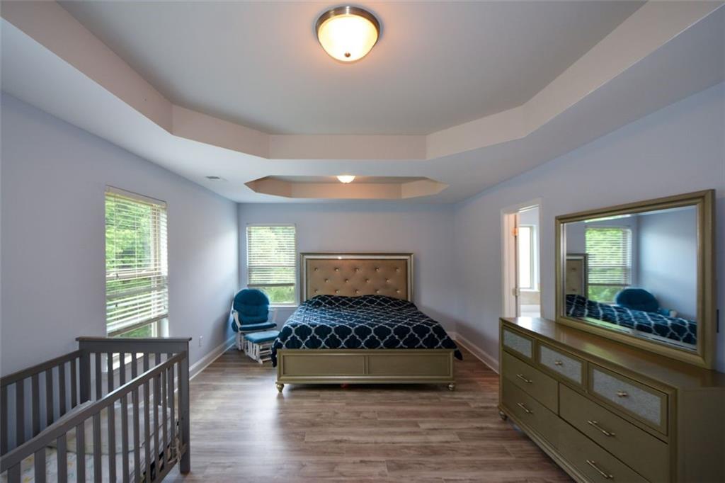 917 Revere Way Hampton, GA 30228 - Photo 15 of 25 a living room with a couch and a large window