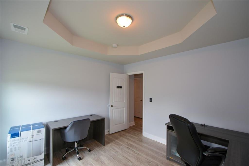 917 Revere Way Hampton, GA 30228 - Photo 18 of 25 a view of workspace with wooden floor space