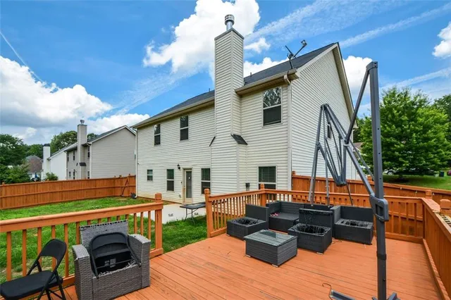 a backyard of a house with seating space