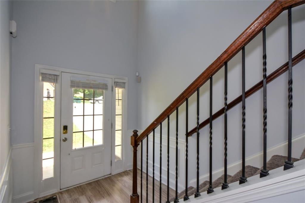 917 Revere Way Hampton, GA 30228 - Photo 4 of 25 a view of an entryway with wooden floor and stairs