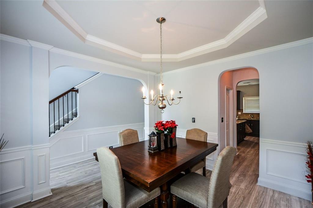 917 Revere Way Hampton, GA 30228 - Photo 6 of 25 a view of a dining room with furniture and wooden floor