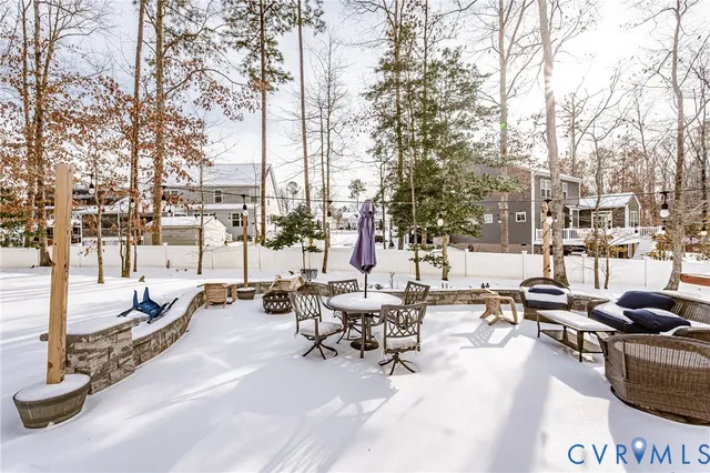 a view of a workspace with furniture and a bookshelf