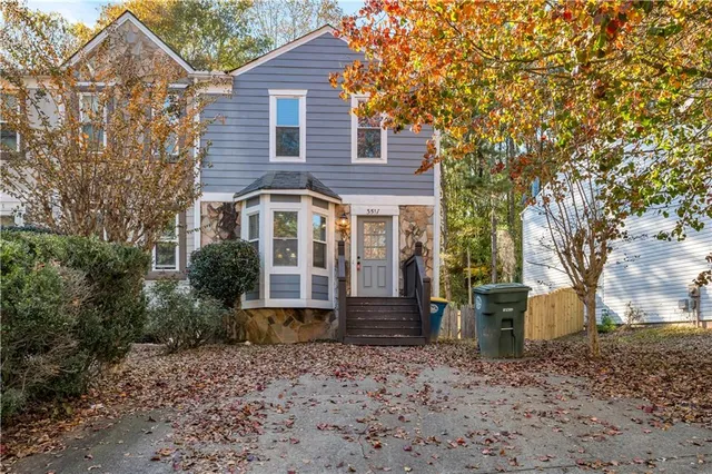 a front view of a house with garden
