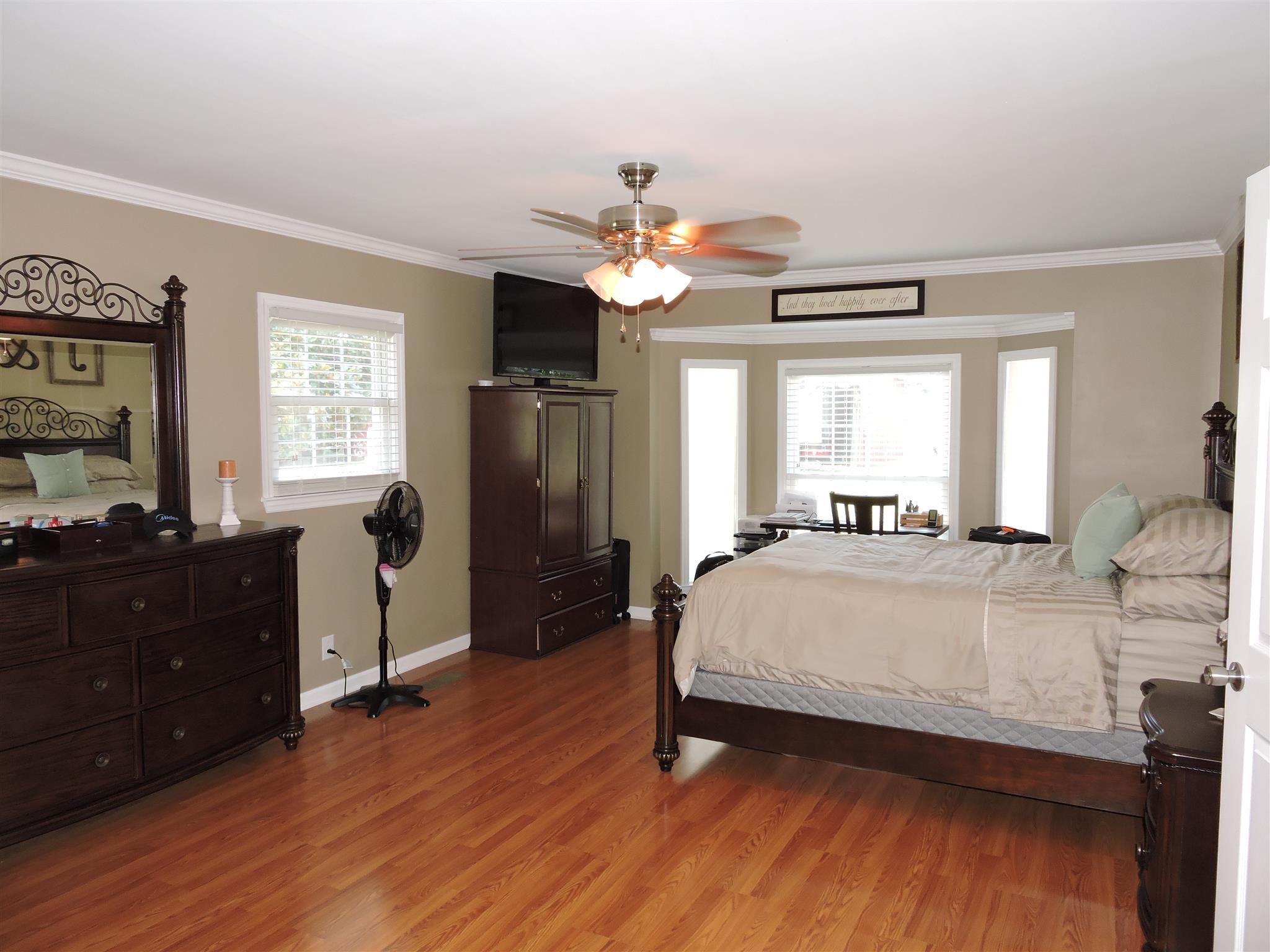9136 Shelbyville Road Morrison, TN 37357 - Photo 8 of 21 a spacious bedroom with a bed and a chandelier