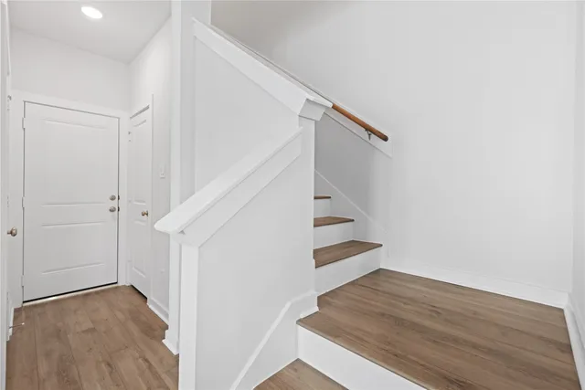 a view of entryway with wooden floor