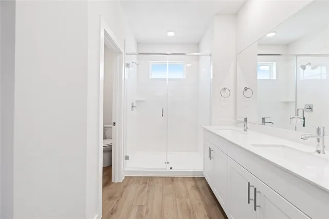 a bathroom with a sink a mirror and a shower