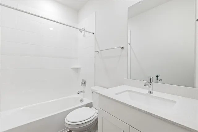 a bathroom with a sink a toilet and a bathtub