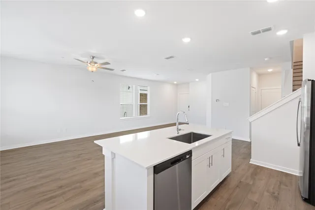 a kitchen with sink and tap