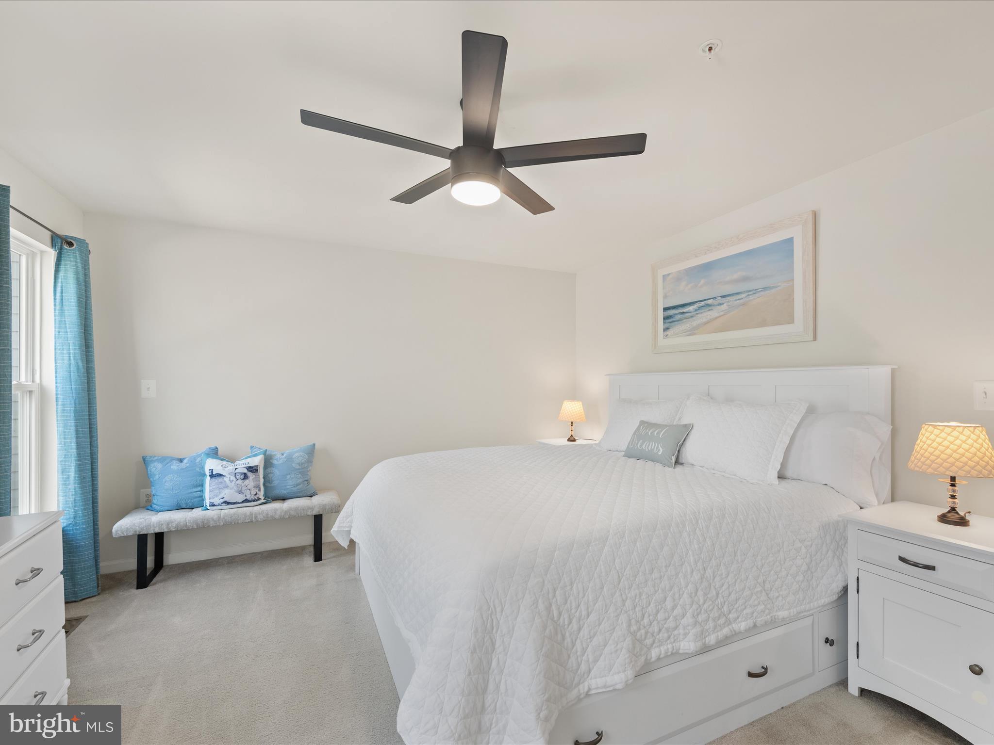 165 Intrepid Lane Berlin, MD 21811 - Photo 16 of 46 a bedroom with a bed and a dresser