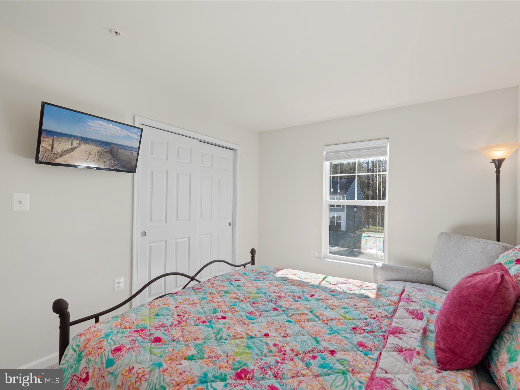 165 Intrepid Lane Berlin, MD 21811 - Photo 24 of 46 a bedroom with a bed and a window