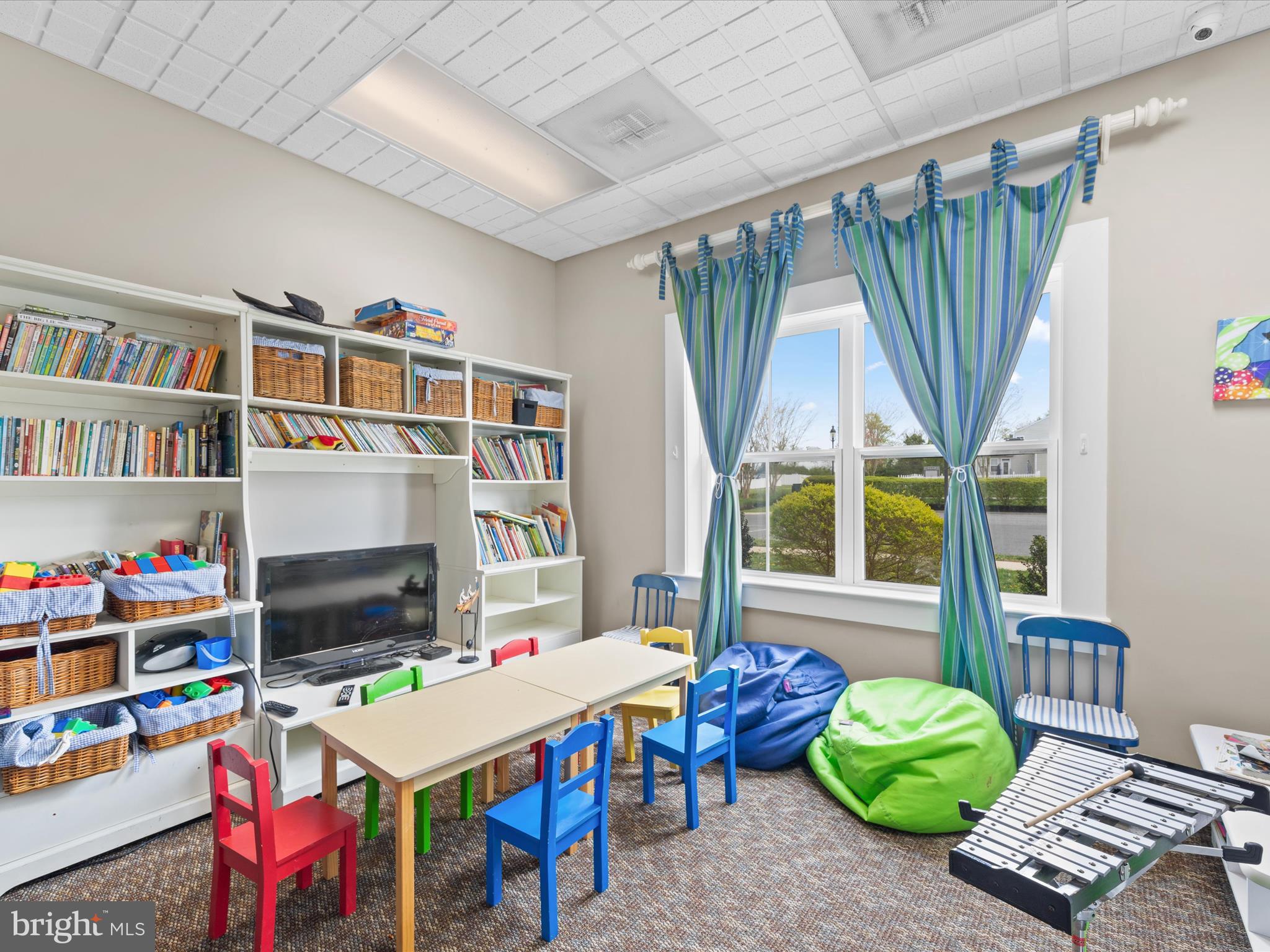 165 Intrepid Lane Berlin, MD 21811 - Photo 40 of 46 a living room with furniture a piano and a table