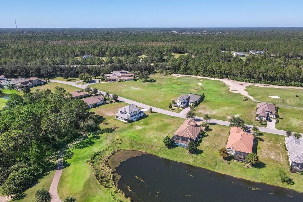 339 Hibiscus Way Palm Coast, FL 32137 - Photo 11 of 16 an aerial view of a house with a lake view