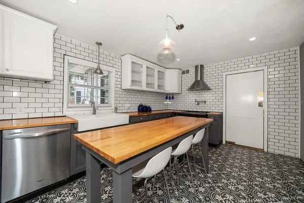 a kitchen with a sink and cabinets