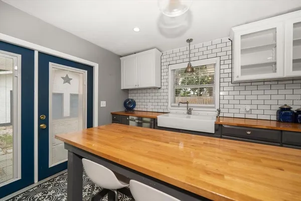 a kitchen with a sink and a stove