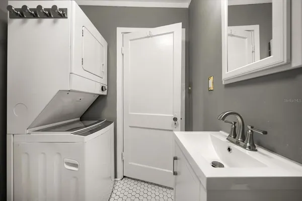 a white toilet sitting next to a bath tub