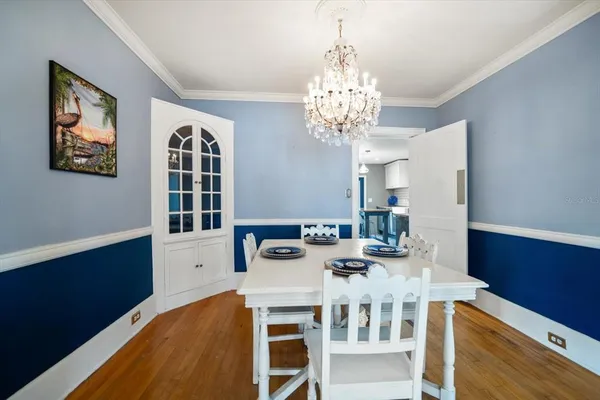 a kitchen with a counter top space a sink stainless steel appliances and cabinets