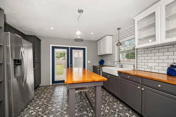 a kitchen with sink cabinets and window