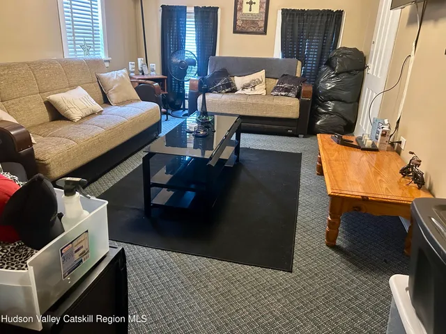 a living room with furniture and a couch