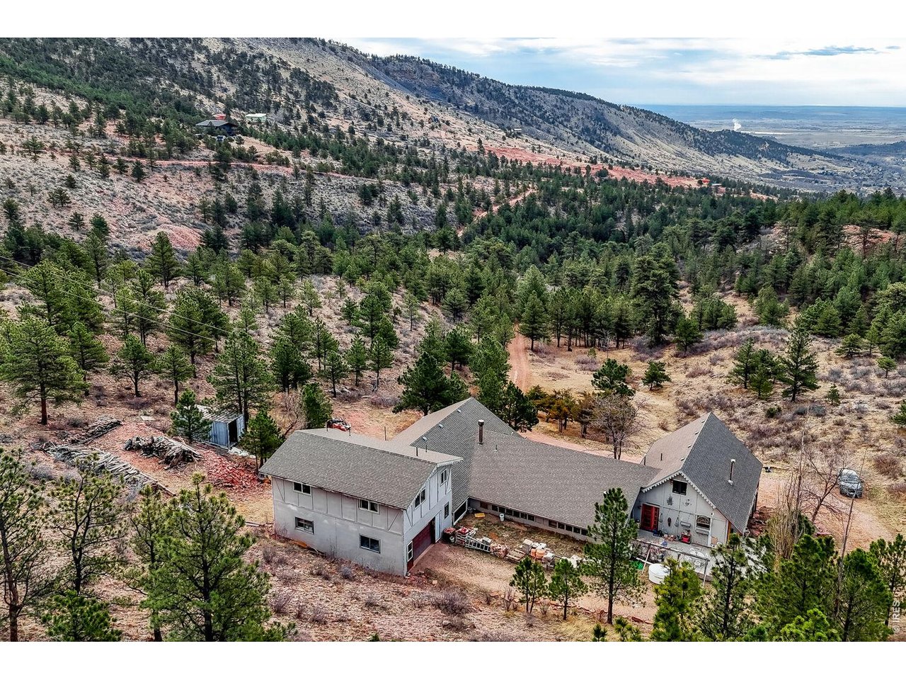 1042 Steamboat Valley Road Lyons, CO 80540 - Photo 46 of 46 Back of home - 4 car drive through garage. 1700 SQ FT + garage!