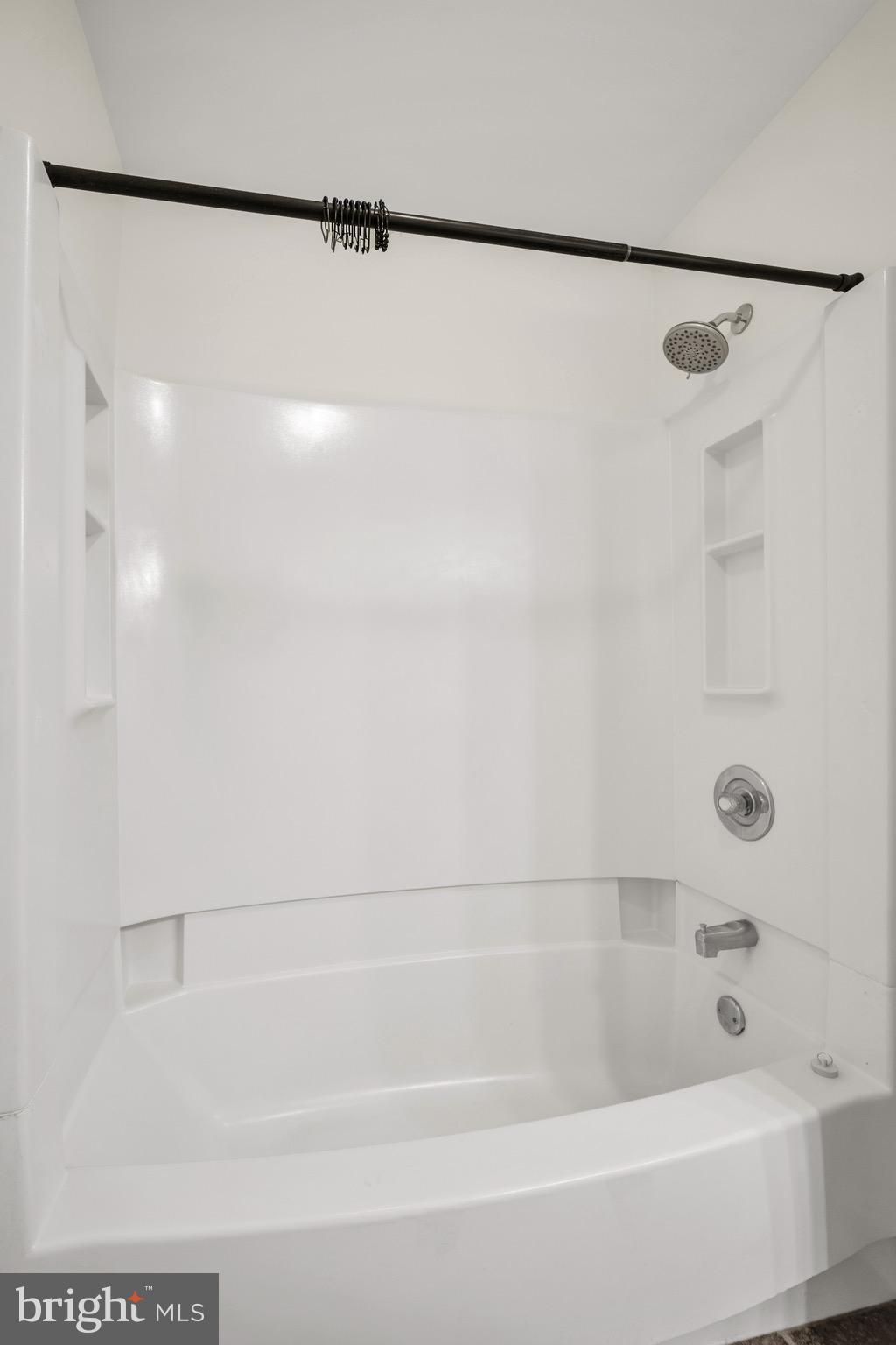2402 Waterford Road, Unit 94 Yardley, PA 19067 - Photo 19 of 28 a bathroom with a shower and a bath tub