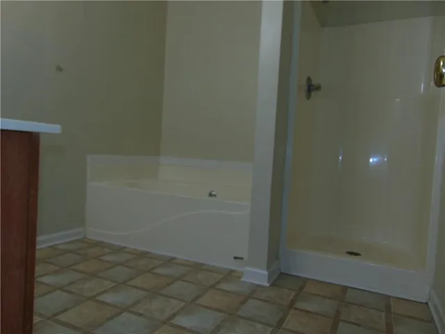 a bathroom with a sink vanity and toilet