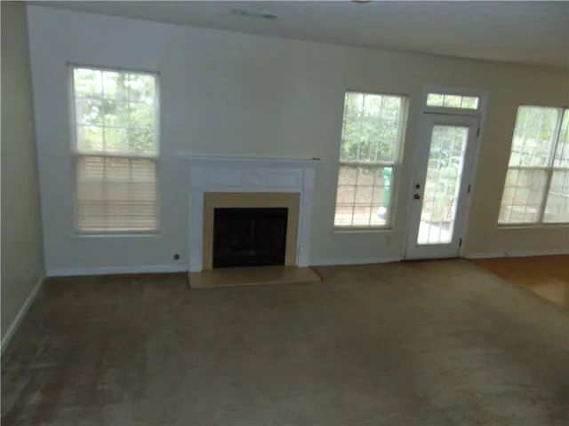 a kitchen with a stove and a microwave