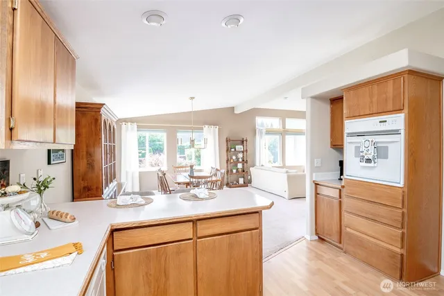 a view of a kitchen with refrigerator and cabinet
